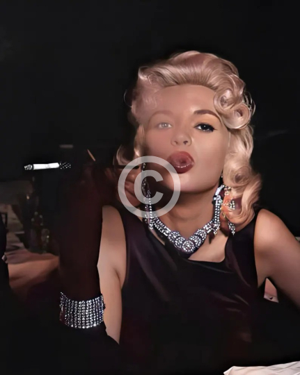 Jayne Mansfield blowing smoke c. 1950s 